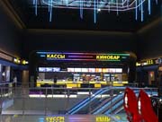 Оформление кассовой зоны кинотеатра и входов в залы кинотеатра. - Интерьерная подсветка с использованием светодиодных лент, объемные буквы, световые короба и контражурная подсветка стен.